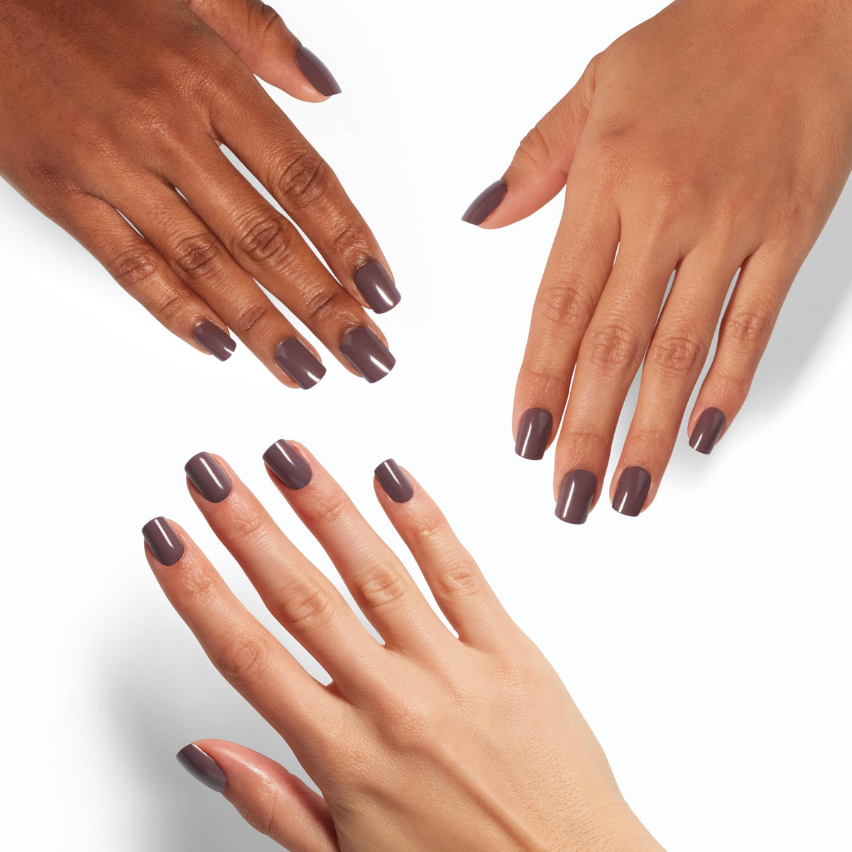 OPI hands applying a press-on with glue demonstrating quick, simple application