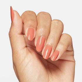 OPI on model hand wearing Apricot AF for bold look and everyday wearability