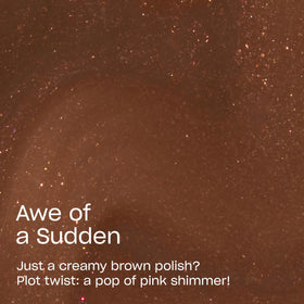 OPI close-up of pink shimmer in dark brown polish highlighting depth