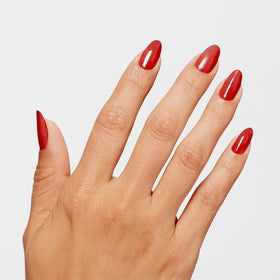 OPI Big Apple Red swatch on nail wheel showing opaque true red color