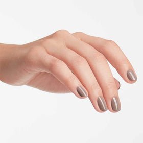 OPI bottle held by hand for size comparison, illustrating portable salon-quality benefit
