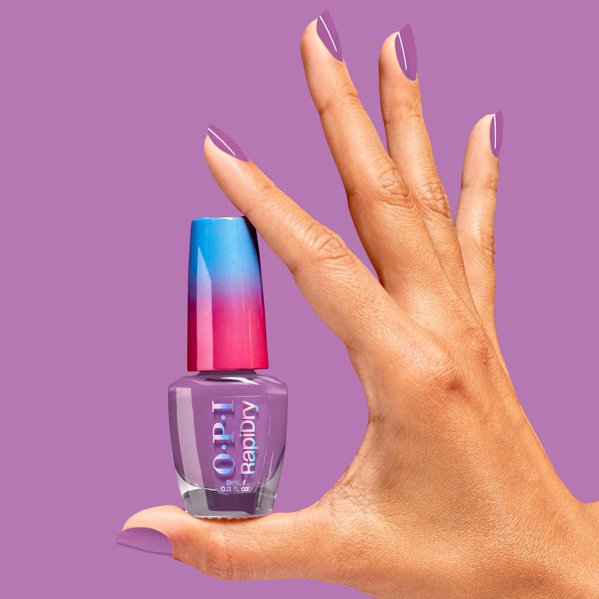 OPI bottle next to coin showing scale and portability for travel-friendly nail care