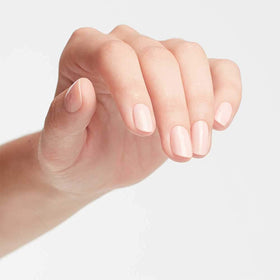 OPI technician dipping nail into powder showing efficient application