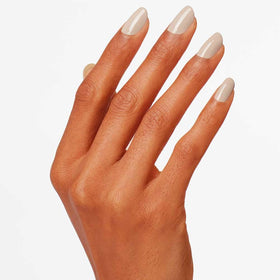 Close-up texture of OPI Coconuts Over OPI lacquer showing glossy crème finish benefit: high shine
