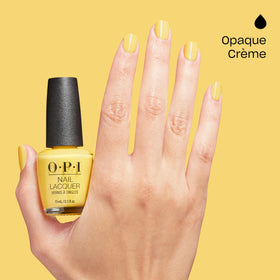 hand holding OPI Daffodil Duck Walk bottle showing true size and easy-grip brush