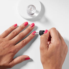 OPI Drip Dry 8ml bottle next to common objects showing compact travel-friendly size