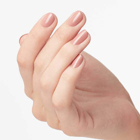 OPI brush spreading Dulce de Leche for even coverage and streak-free application