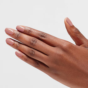 OPI Dulce de Leche on-nail swatch on hand illustrating opaque brown crème shine