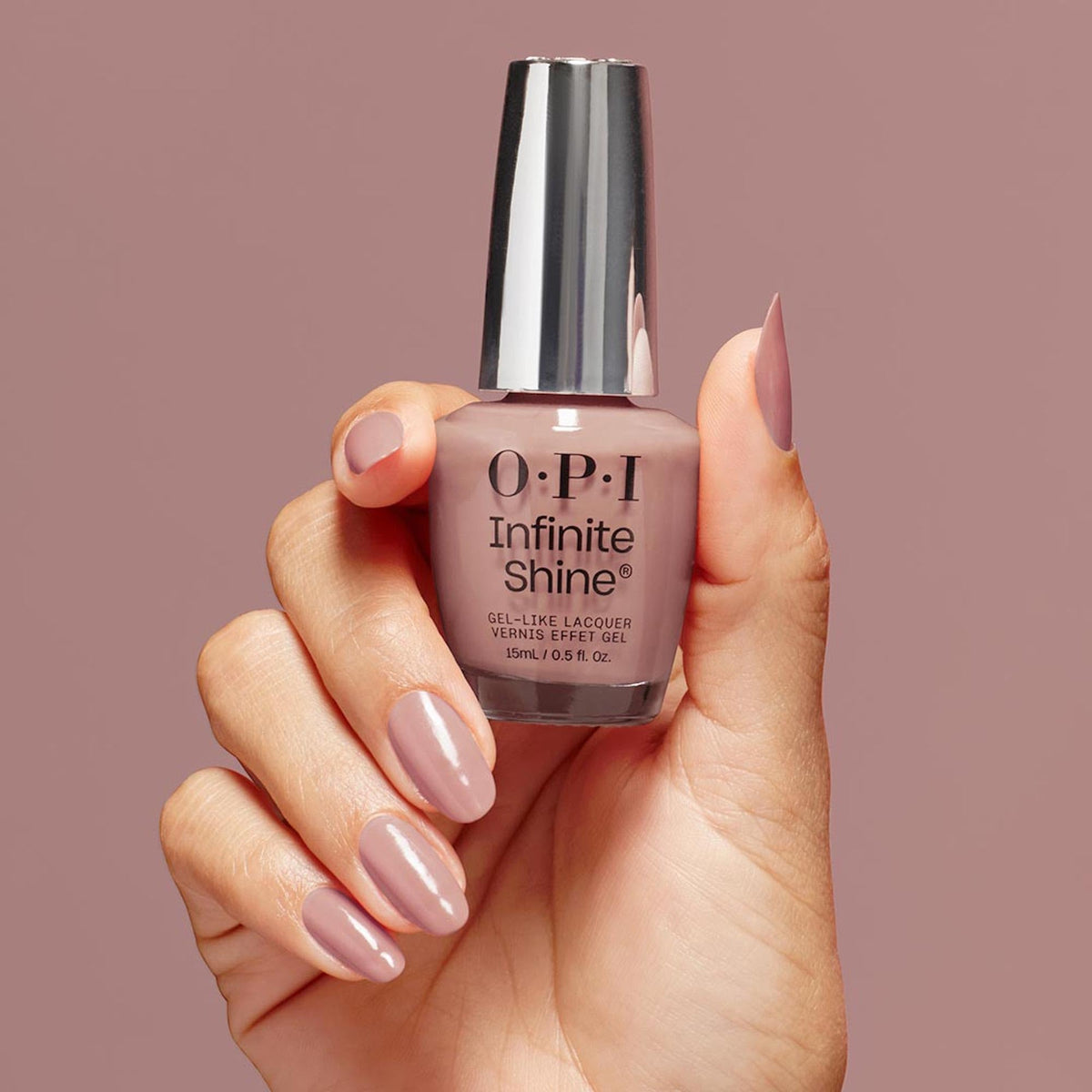 OPI Dulce de Leche bottle held by hand to show real size and easy application benefit