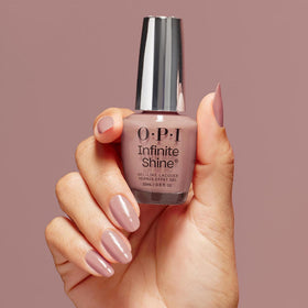 OPI Dulce de Leche bottle held by hand to show real size and easy application benefit