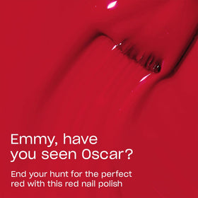 OPI brush spreading red lacquer smoothly for even, streak-free coverage