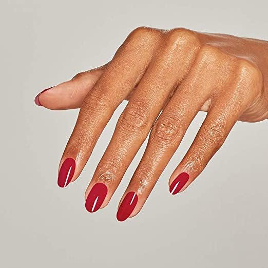 Model holding OPI bottle to show how the red lacquer looks on nails