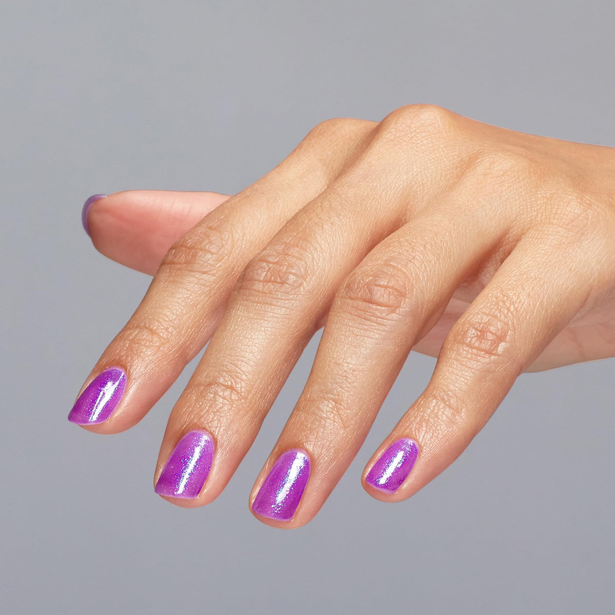 OPI nail swatches on hand showing wearable sheer purple layering