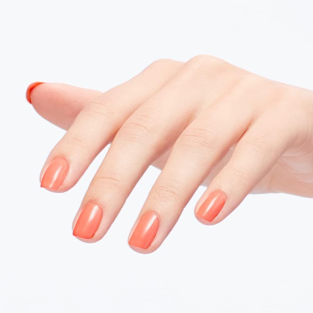 Pedicure on toes with OPI coral demonstrating durable, salon-style finish