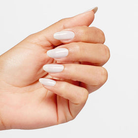 OPI Funny Bunny bottle next to coin showing true size and travel-friendly benefit