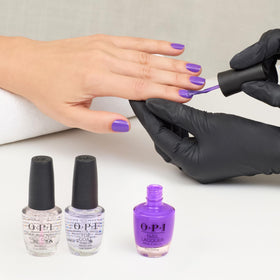 Lifestyle image of OPI nails at the beach showcasing summer-ready bright color benefit