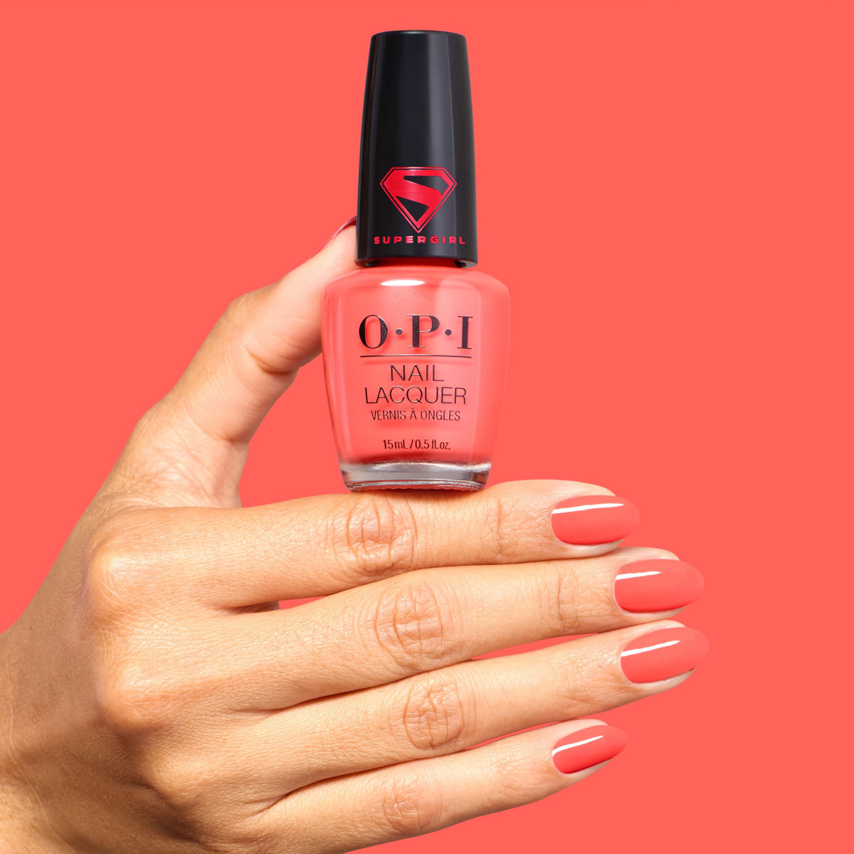 OPI Heat Vision on model hands showing wearable bold coral for styling ideas