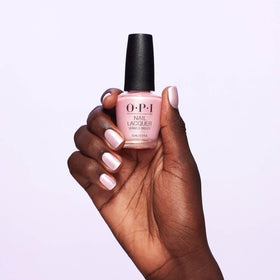 OPI brush applying sheer pink pearl polish for even coverage and smooth finish benefit