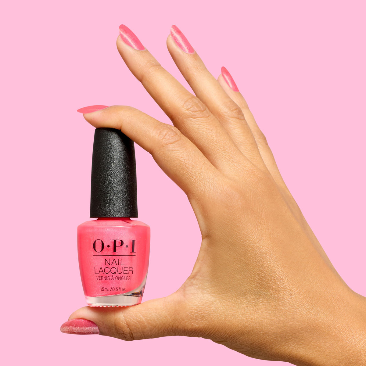 Hand model wearing OPI pinka coladas manicure for vibrant summer look