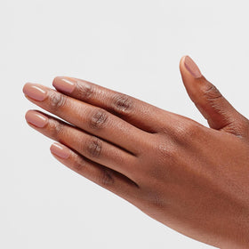OPI manicured hand wearing Barefoot in Barcelona for polished look