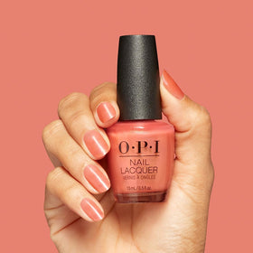 OPI color swatch on wrist illustrating buildable sheer coverage and true-to-tone benefit