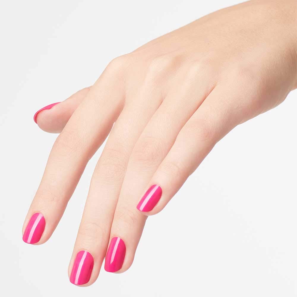 OPI La Paz-itively Hot bottle in hand showing size and salon-quality finish