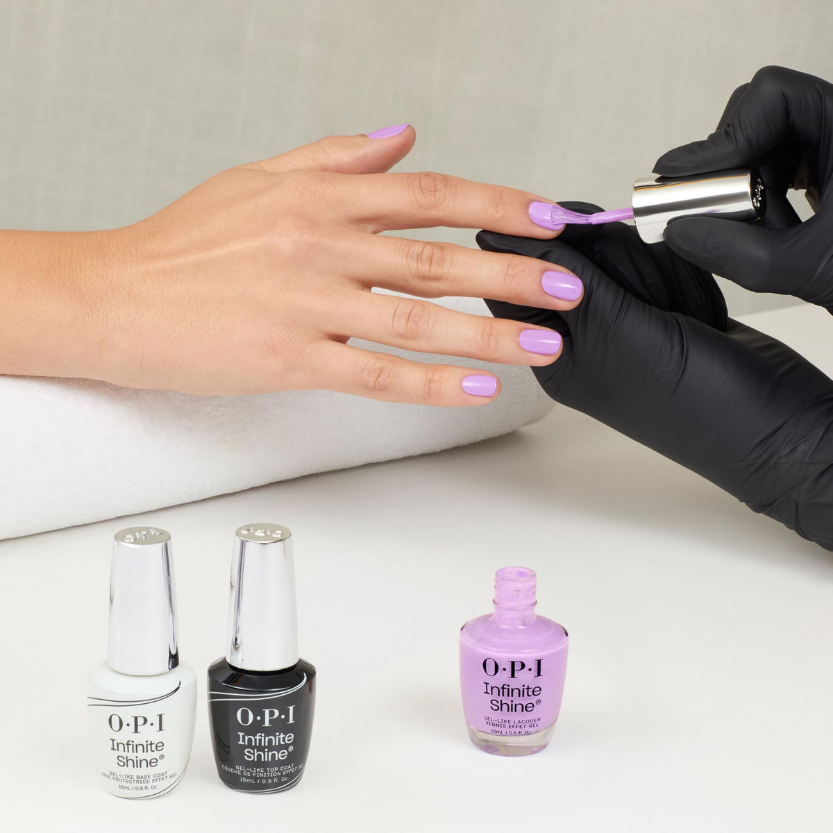 OPI Learn to Fly-lac styled on nails in a beach setting showing summer-ready color benefit