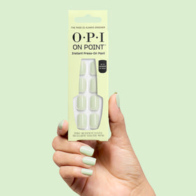 OPI press-on nails styled with spring outfit showing high-impact color for outfits