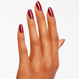 Manicure with OPI Malaga Wine on nails showing salon-quality shine and lengthening effect