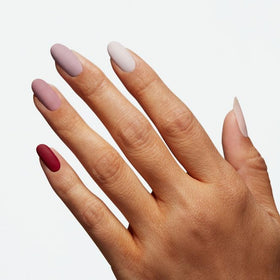 OPI bottle held in hand to show size and easy application benefit