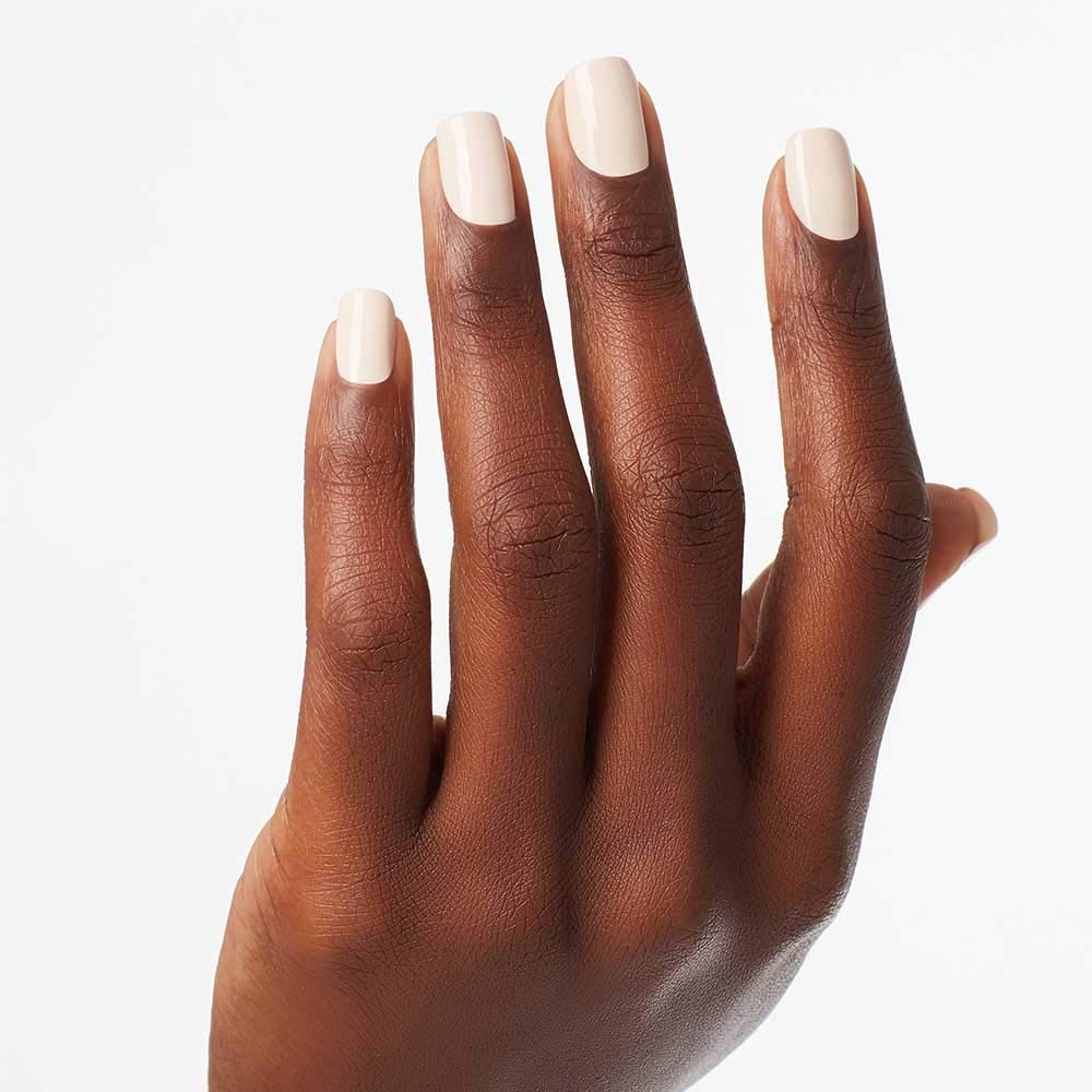 OPI polished nails on hand model showing natural nude look and elegance