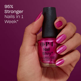 OPI brush applying Powerful Pink stroke demonstrating smooth coverage benefit