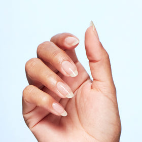 OPI Nature Strong held in hand showing compact size and control