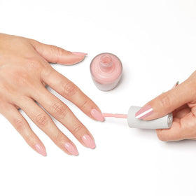OPI Nature Strong lifestyle flatlay with natural props showing eco-friendly aesthetic