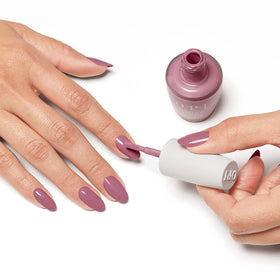 OPI bottle beside ruler showing bottle size for storage and travel convenience
