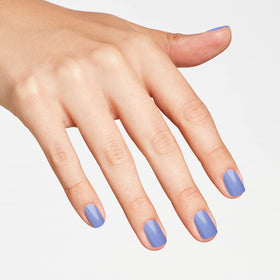 OPI painted nails in lifestyle setting showing wearable blue shimmer look
