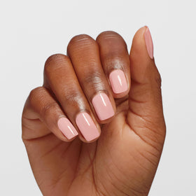 OPI swatch on nail wheel showing translucent pale pink buildable coverage benefit