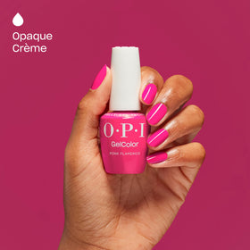 OPI Pink Flamenco curing under LED lamp for fast, smudge-proof finish