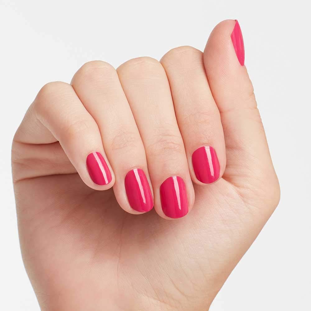 OPI Pink Flamenco nail swatch on hand showcasing opaque bright pink finish
