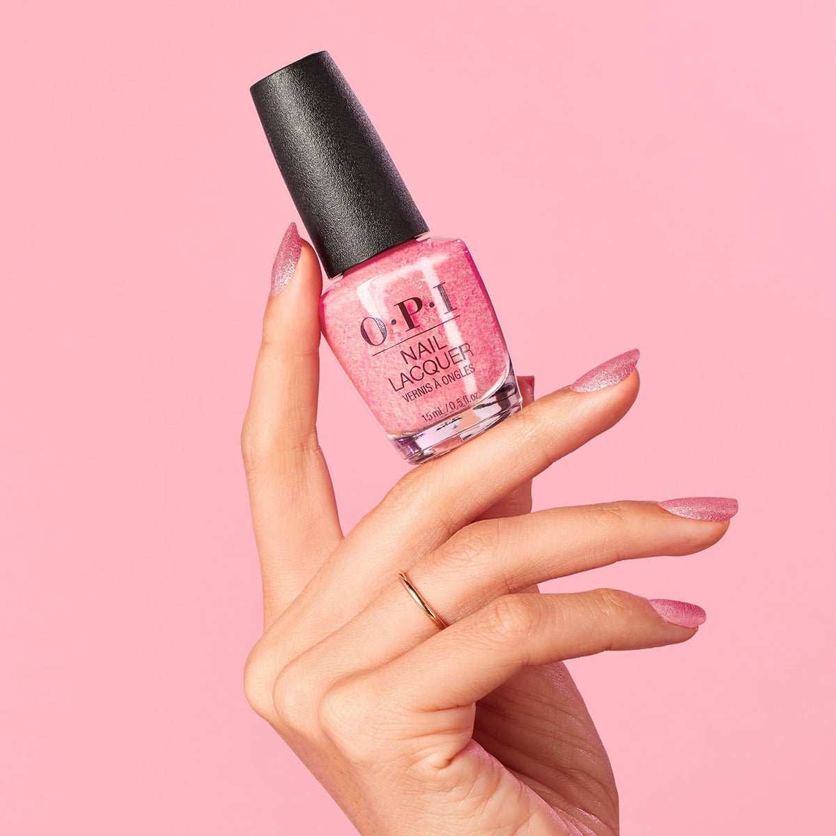 OPI polished hand wearing Pixel Dust in lifestyle shot, shows durable luminous finish