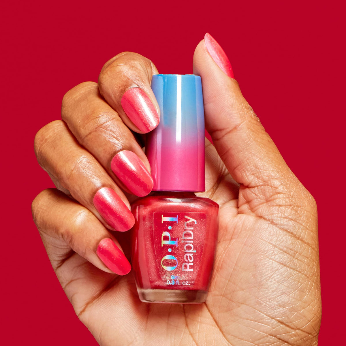Two-coat manicure with OPI RapiDry Fuego on nails showing durable glossy shine