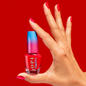 OPI Haul Sass on hands at desk demonstrating quick-dry convenience