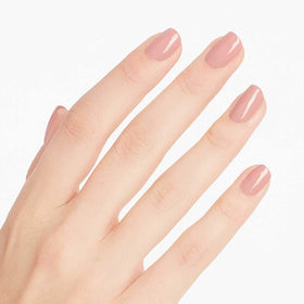 OPI polished nails wearing rosy pink in lifestyle setting for wearable look