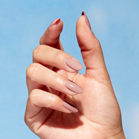 OPI swatch on fingernails showing wearable neutral color benefit