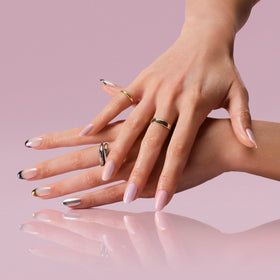 OPI tin next to a hand for size comparison and easy travel convenience