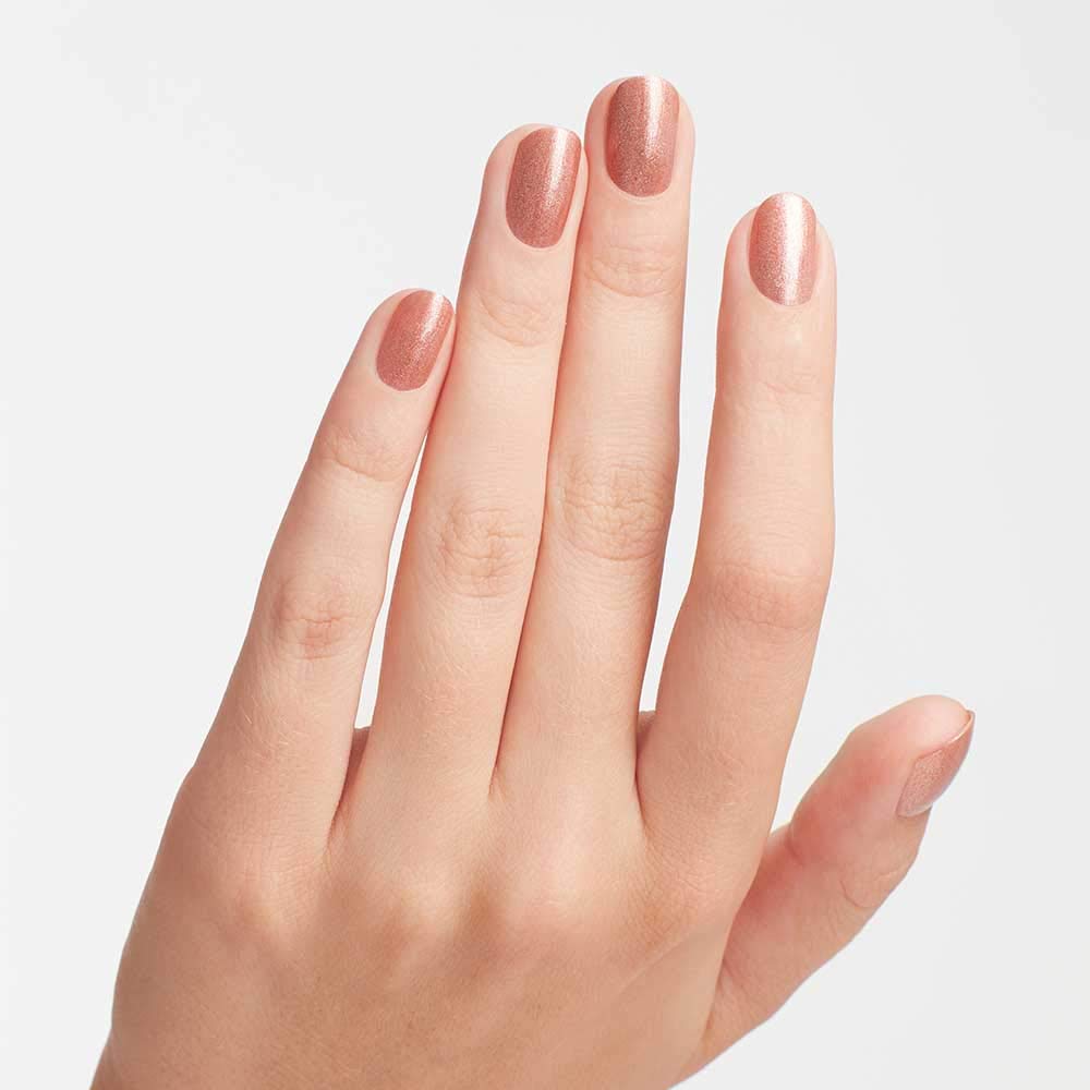 OPI manicure with Worth a Pretty Penne on nails showing long-lasting shine