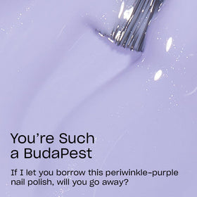 OPI swatch on hand showing true periwinkle tone and flattering effect benefit