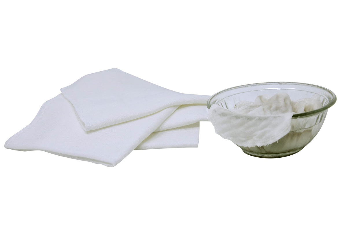 Organic Cotton Mart folded stack on bath towel styled for sustainable skincare