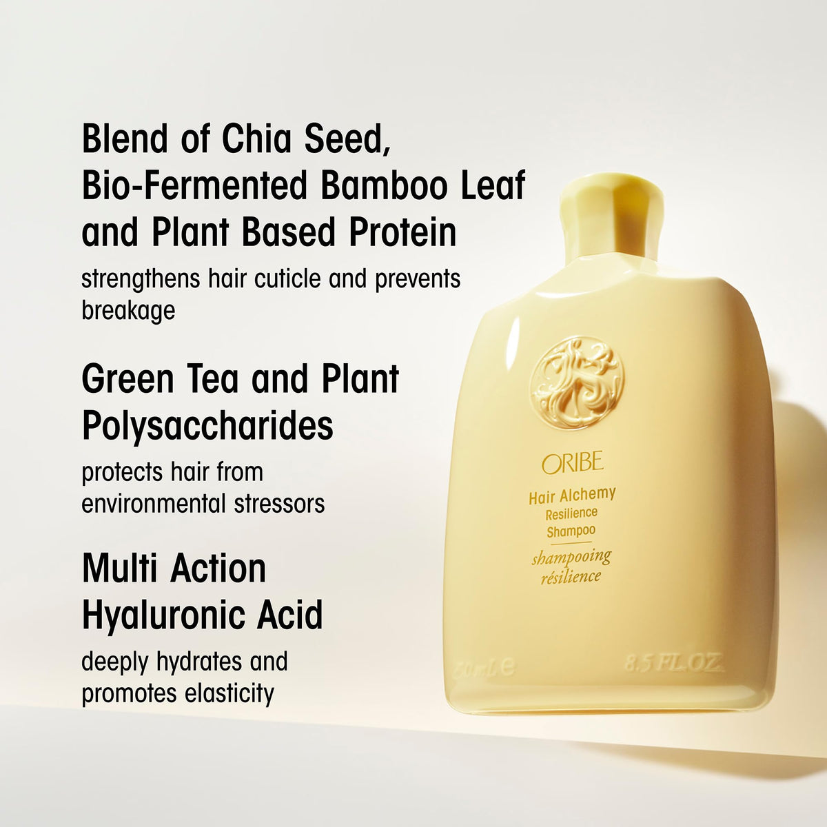Oribe 2.5 oz travel bottle held in hand showing compact size ideal for trips