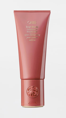 Oribe bright blonde in use styling on blonde hair showing smooth, shiny results